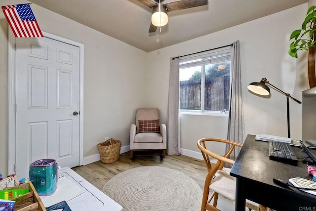 office area with ceiling fan and light hardwood / wood-style floors