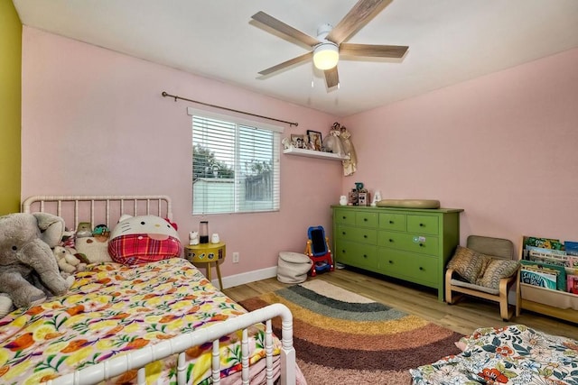 bedroom featuring ceiling fan and light hardwood / wood-style floors