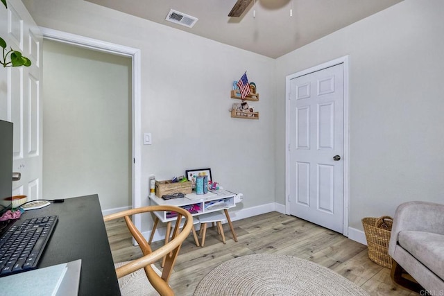 home office with ceiling fan and light wood-type flooring