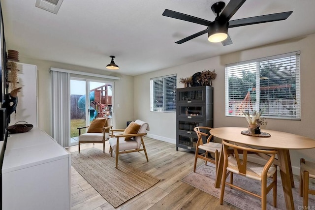 dining area featuring ceiling fan, a healthy amount of sunlight, and light hardwood / wood-style floors