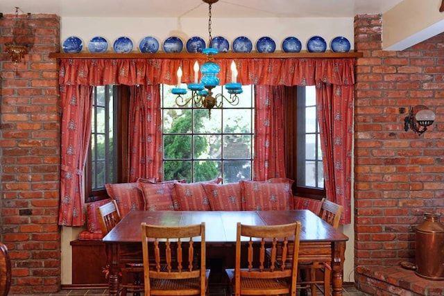 dining room with breakfast area and a notable chandelier