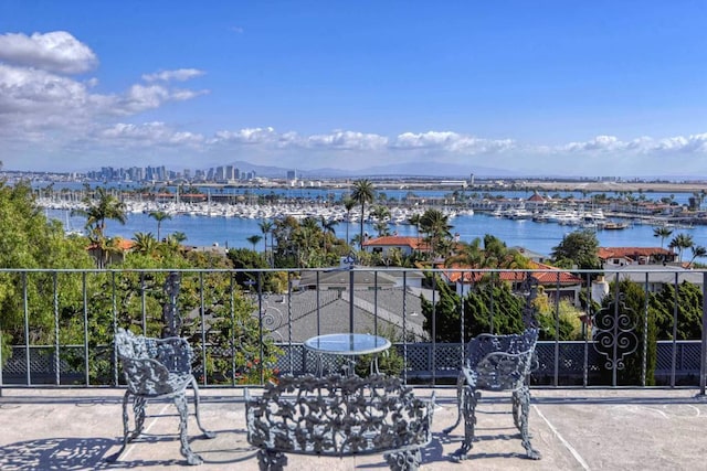 balcony featuring a water view