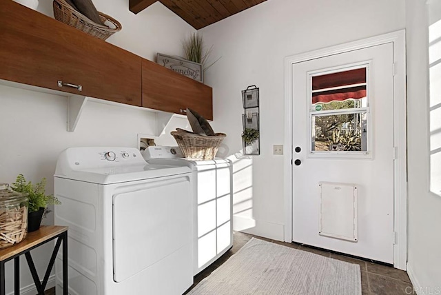 washroom featuring washing machine and dryer and cabinets