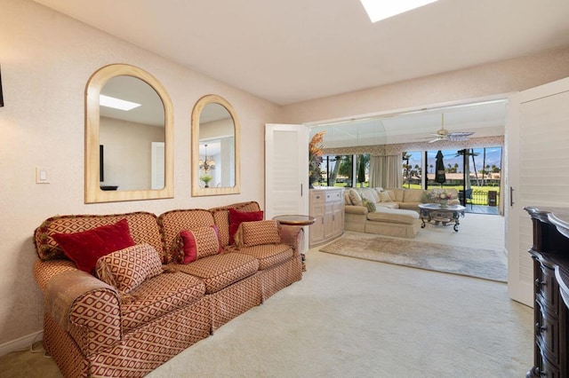 living room featuring light carpet and ceiling fan