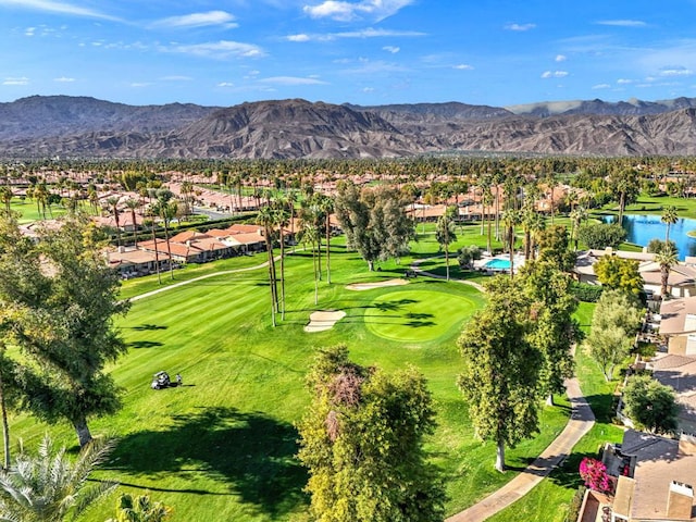 birds eye view of property with a water and mountain view