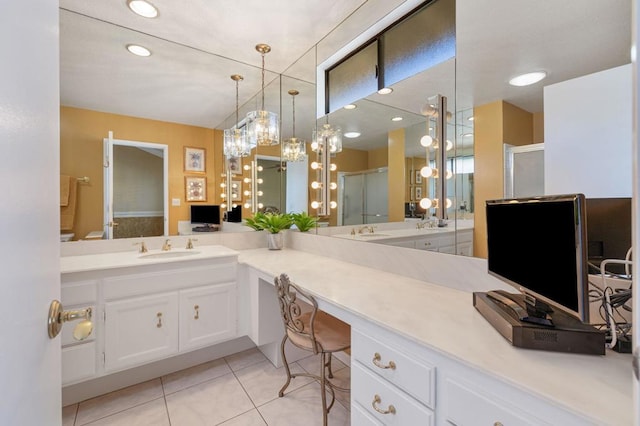 bathroom with vanity, an enclosed shower, and tile patterned flooring