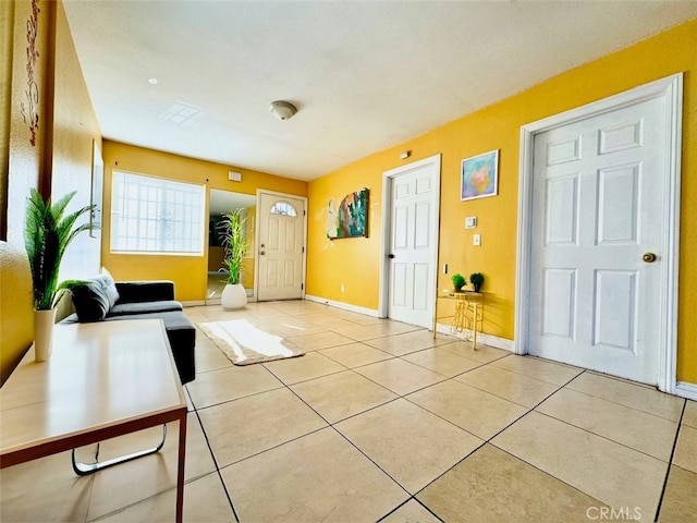 foyer entrance featuring light tile patterned floors