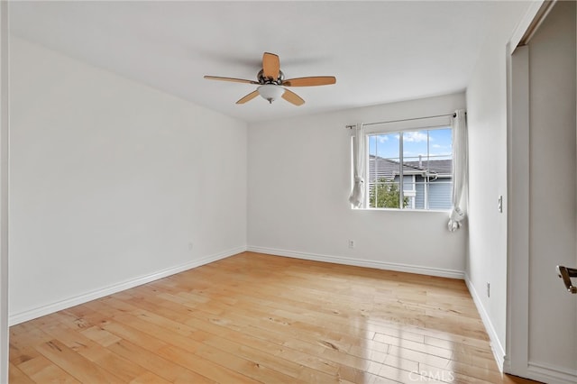 unfurnished room with light hardwood / wood-style flooring and ceiling fan