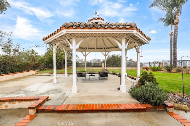 view of home's community with a gazebo, a patio area, and a lawn