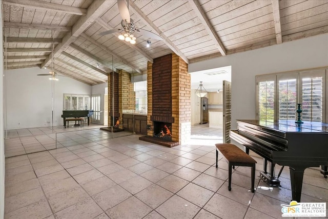 misc room featuring a fireplace, beamed ceiling, tile patterned flooring, ceiling fan, and wood ceiling