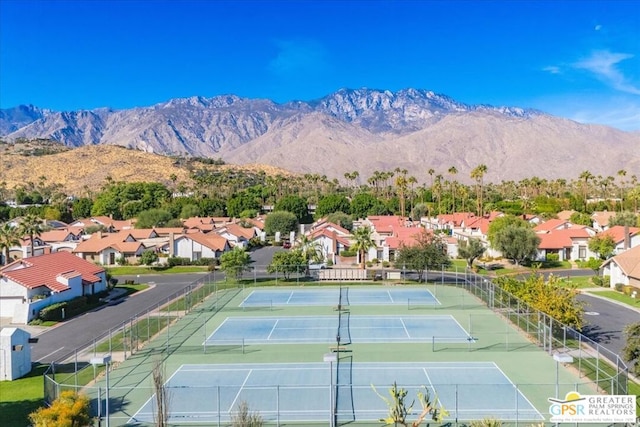 view of tennis court with a mountain view