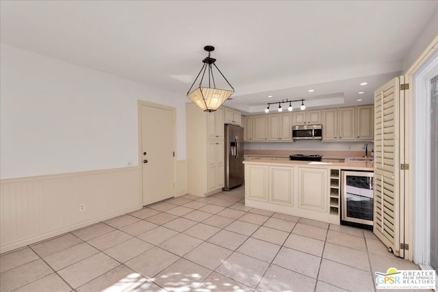 kitchen featuring pendant lighting, sink, appliances with stainless steel finishes, wine cooler, and light tile patterned flooring