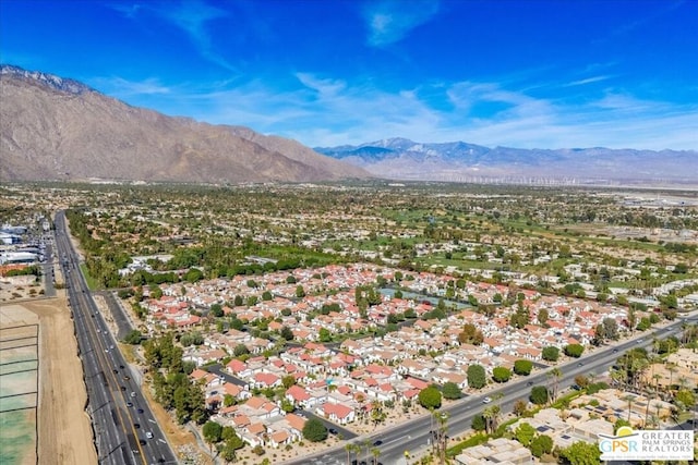 birds eye view of property featuring a mountain view