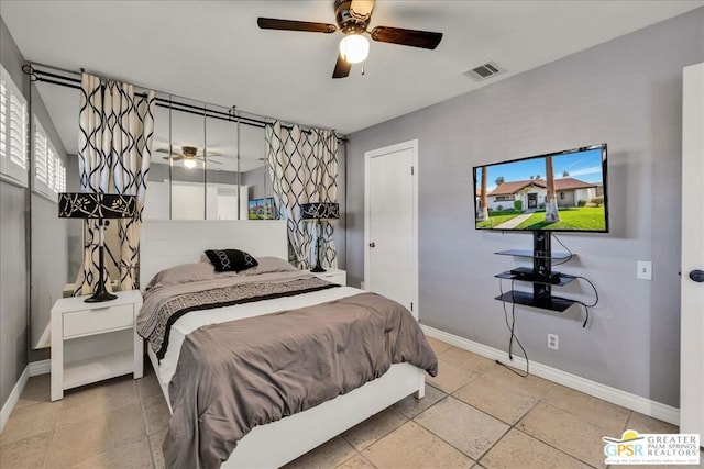 bedroom featuring multiple windows and ceiling fan