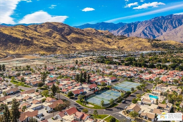 birds eye view of property with a mountain view