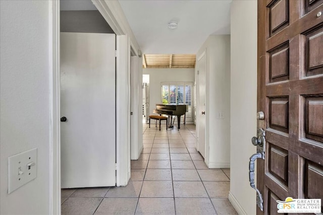 hallway with light tile patterned flooring