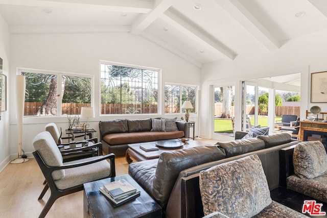 sunroom / solarium with vaulted ceiling with beams