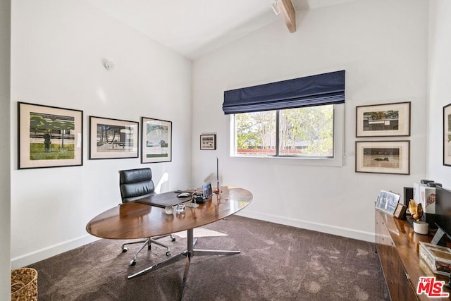 office with vaulted ceiling with beams and dark colored carpet