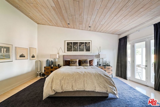 bedroom featuring access to exterior, wood ceiling, and light wood-type flooring