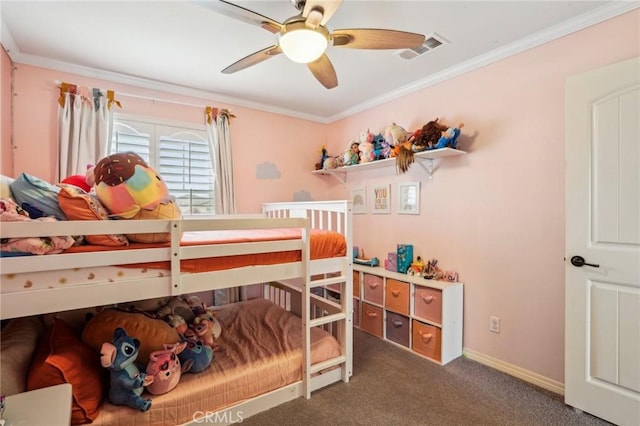 carpeted bedroom with ornamental molding, visible vents, ceiling fan, and baseboards