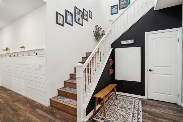 stairway featuring wood finished floors