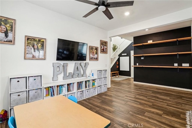 recreation room featuring ceiling fan, dark wood finished floors, and recessed lighting