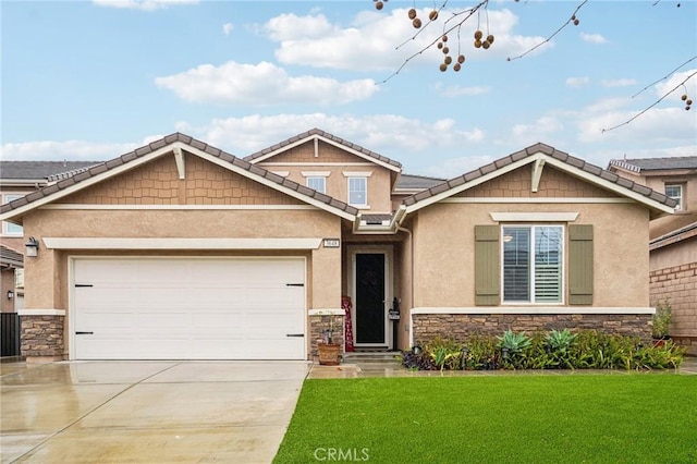 craftsman-style house featuring stone siding, concrete driveway, a front lawn, and stucco siding