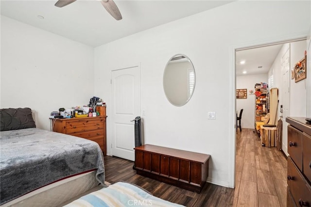 bedroom featuring a ceiling fan and dark wood finished floors