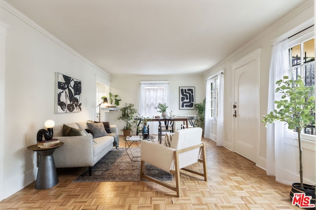 living room featuring crown molding and light parquet floors