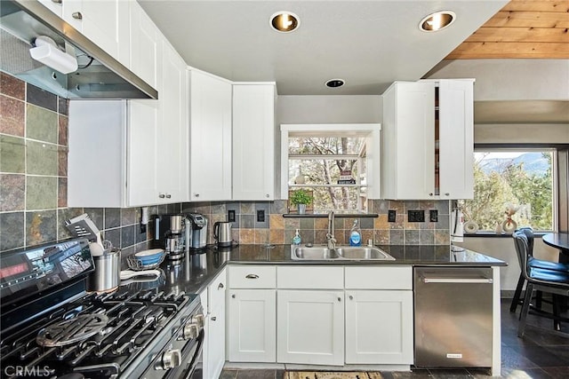 kitchen featuring a sink, gas range, white cabinets, and dishwasher