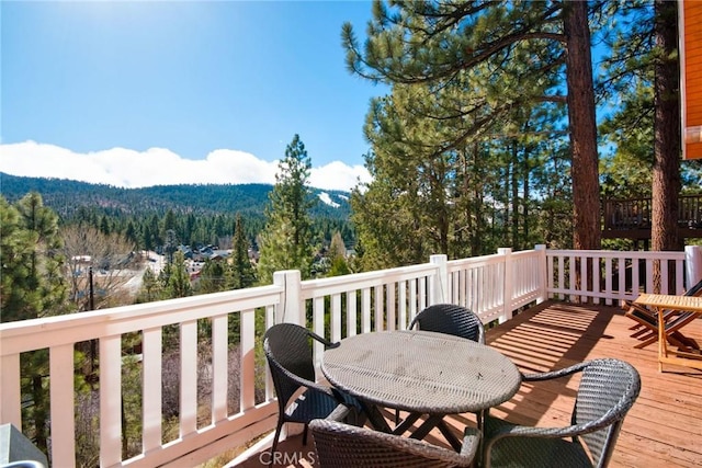 deck featuring a forest view