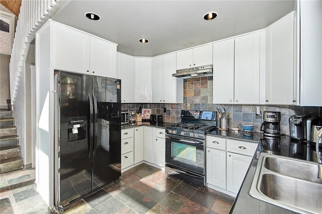 kitchen featuring under cabinet range hood, a sink, white cabinetry, black appliances, and dark countertops