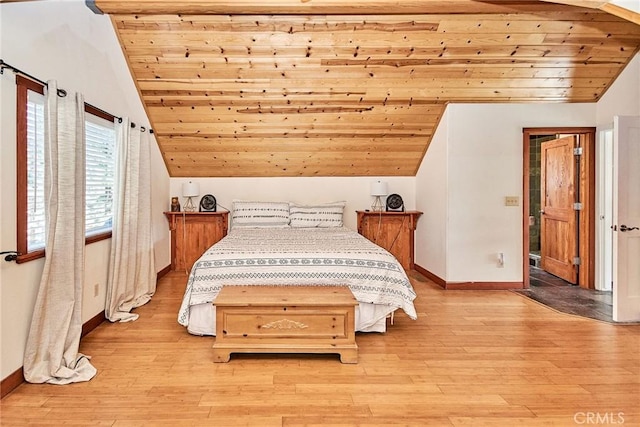 bedroom with wooden ceiling, light wood-style floors, baseboards, and lofted ceiling