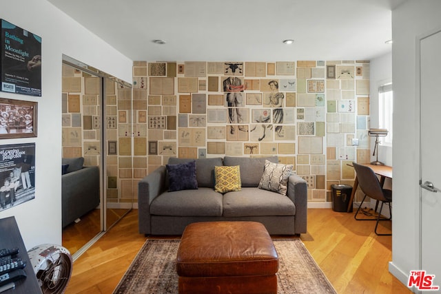 sitting room with wood-type flooring