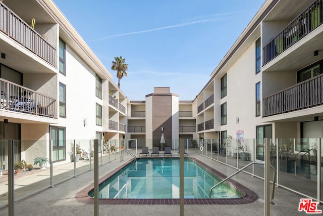 view of pool featuring a patio