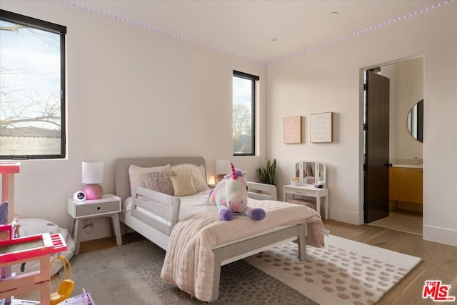 bedroom featuring hardwood / wood-style flooring