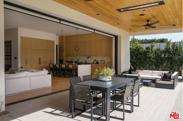 exterior space featuring ceiling fan and an outdoor hangout area