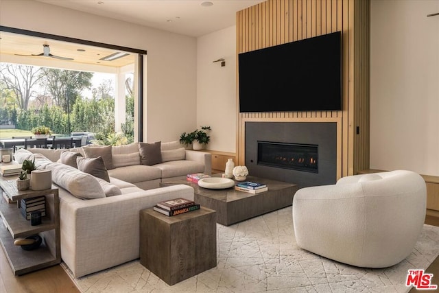 living room featuring a large fireplace