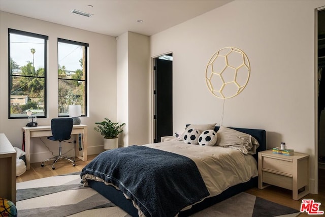 bedroom featuring light wood-type flooring