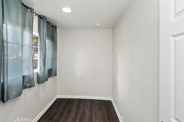 spare room featuring dark hardwood / wood-style flooring