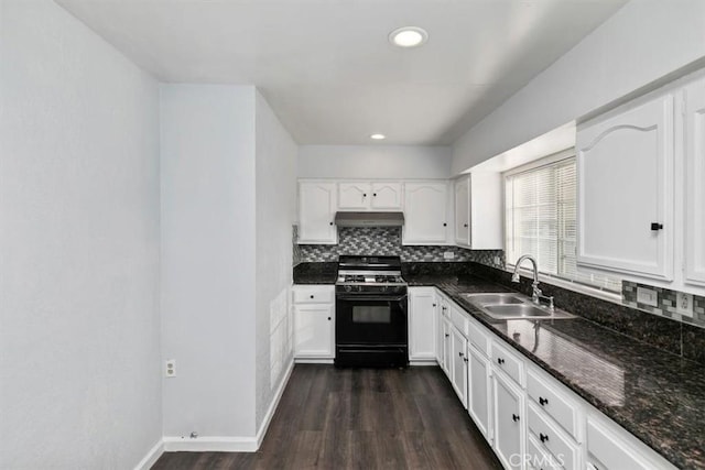 kitchen featuring white cabinetry, sink, dark stone countertops, and range with gas stovetop