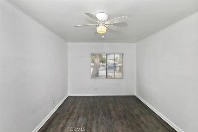 spare room with ceiling fan and dark hardwood / wood-style flooring