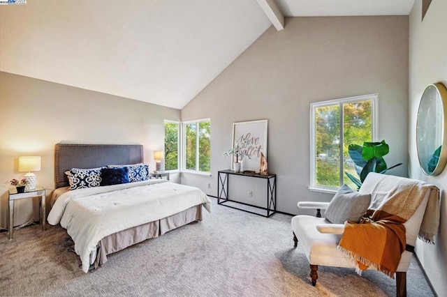 carpeted bedroom with high vaulted ceiling and beamed ceiling