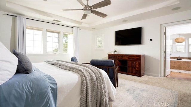 19 Basilica Pl, Ladera Ranch, CA 92694 - bedroom with carpet floors, a raised ceiling, connected bathroom, and a ceiling fan