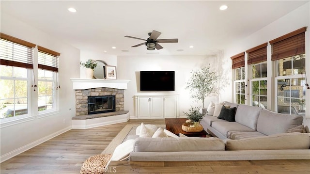 19 Basilica Pl, Ladera Ranch, CA 92694 - living area with plenty of natural light, ceiling fan, recessed lighting, a fireplace, and light wood-type flooring