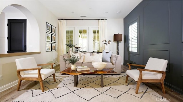 19 Basilica Pl, Ladera Ranch, CA 92694 - sitting room featuring light wood-style flooring and arched walkways