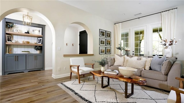19 Basilica Pl, Ladera Ranch, CA 92694 - living room featuring wood finished floors and arched walkways