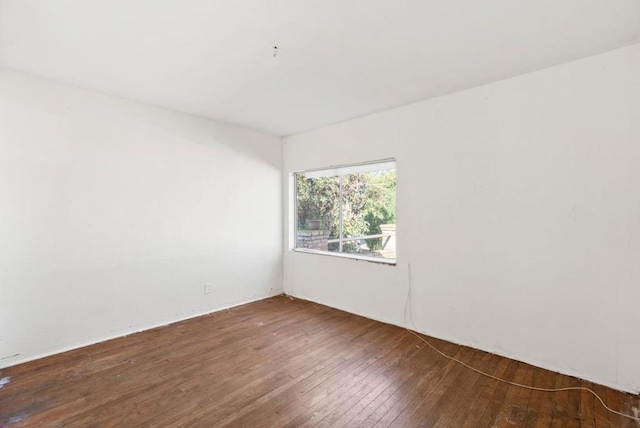 empty room featuring dark hardwood / wood-style floors