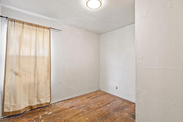 spare room featuring hardwood / wood-style flooring