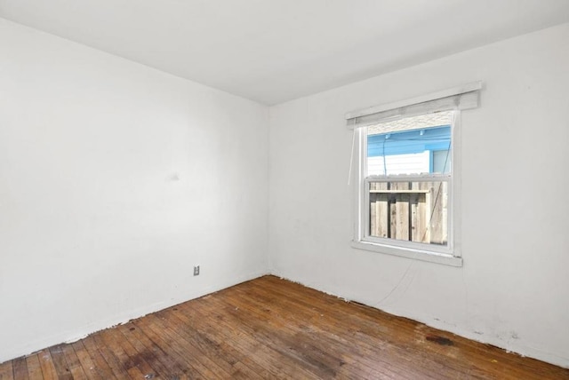 spare room with hardwood / wood-style floors